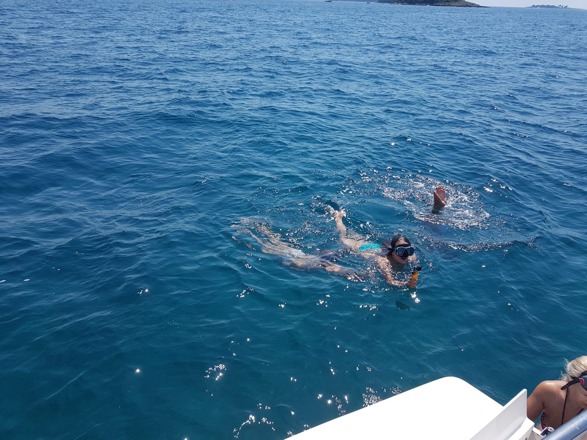 Guest snorkeling next to the boat