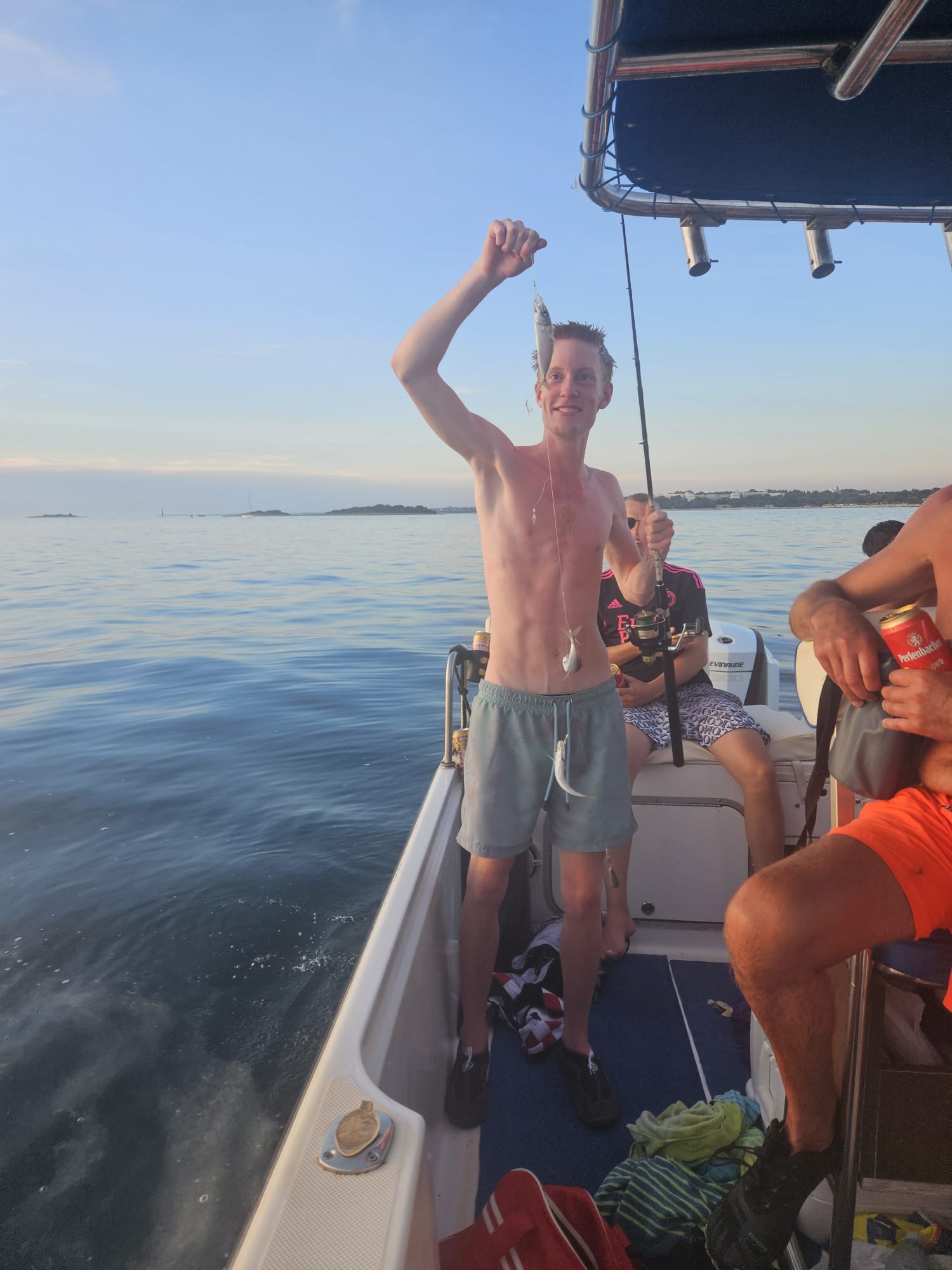 Kids fishing on board